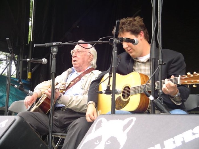 Bluegrass guitarists George Shuffler and Bryan Sutton on stage