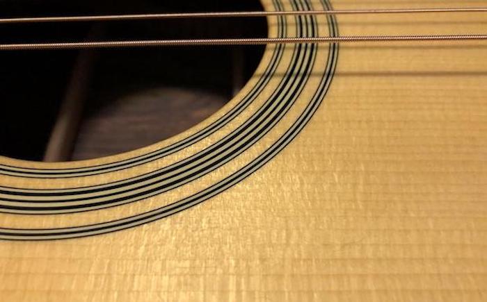 Adirondack spruce guitar top laid so the wide grain runs horizontally