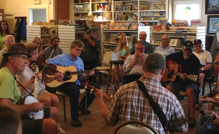 Bluegrassers jam in a circle at the Floyd Country Store