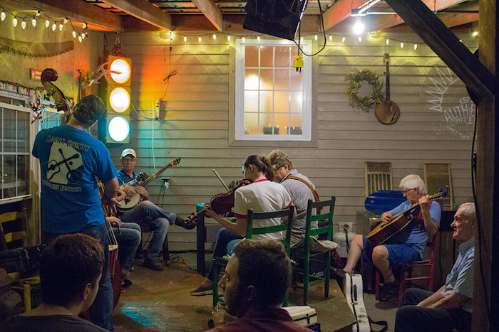 Musicians play bluegrass on the outdoor patio of a coffee shop in Nashville